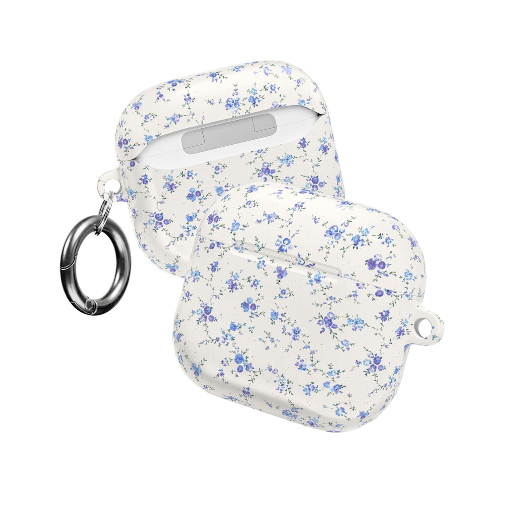 Blue ditsy floral AirPods case with side key ring and hook loop, white shell profile