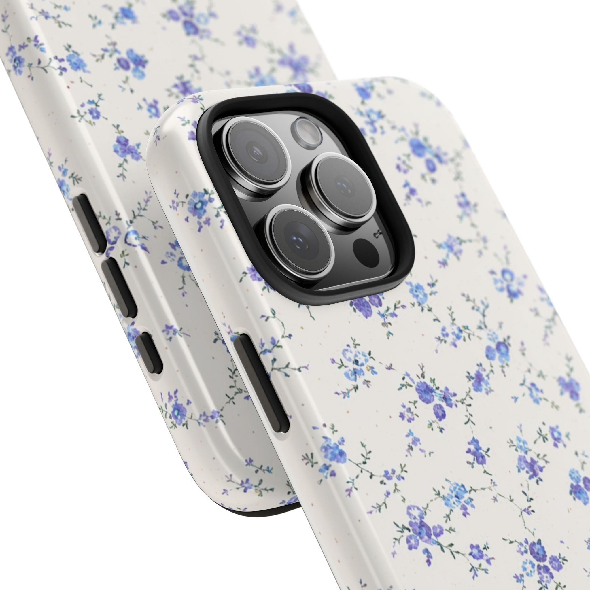 Cream phone case in ditsy blue and purple florals; side buttons and lens bump visible