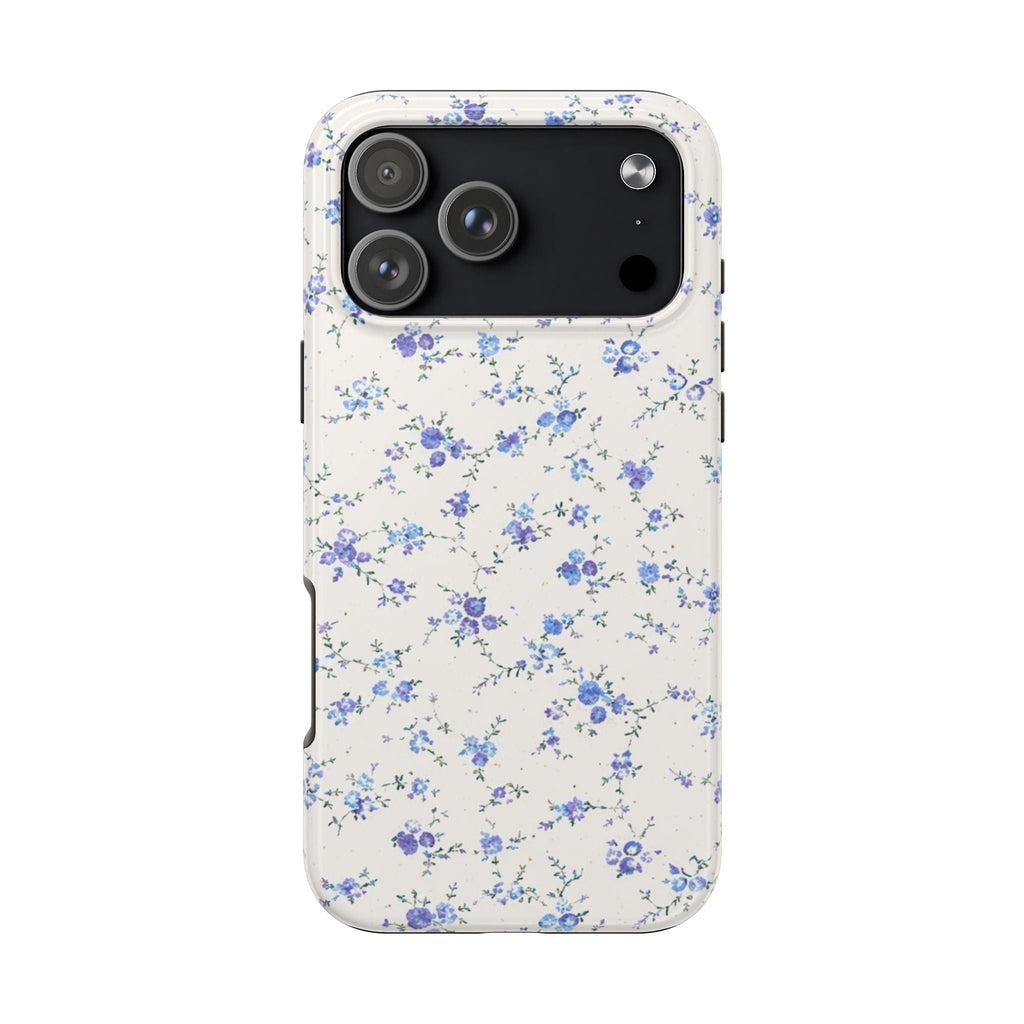 Cream back phone case with scattered blue/purple ditsy florals and camera lens openings