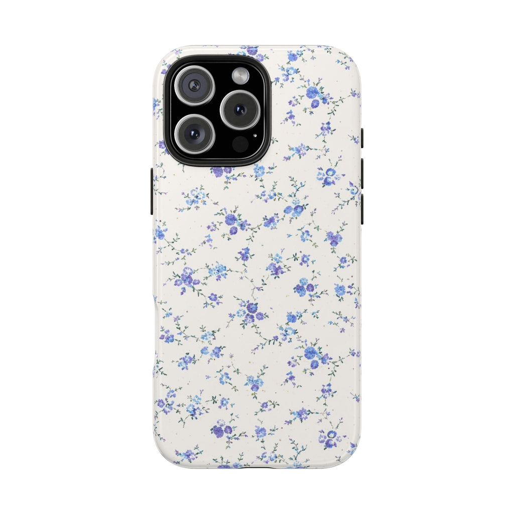 Cream phone case with small blue and purple floral ditsy pattern; raised camera cutouts