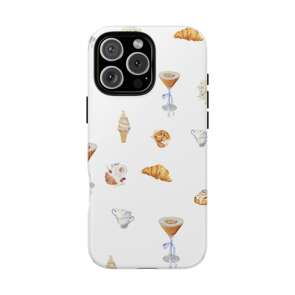 White phone case with assorted dessert illustrations, clear edges, and cutouts for cameras