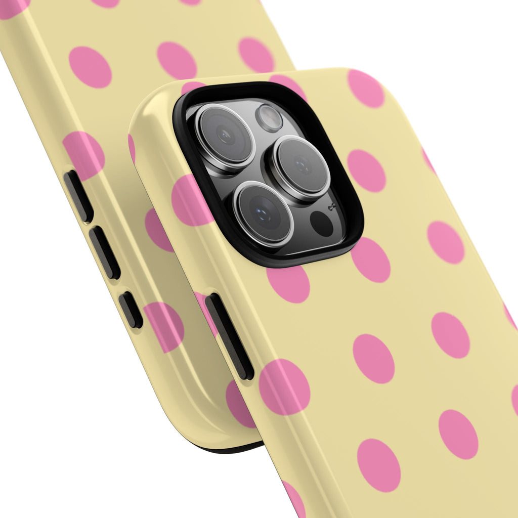 Close-up cream phone case with pink polka dots and lens openings