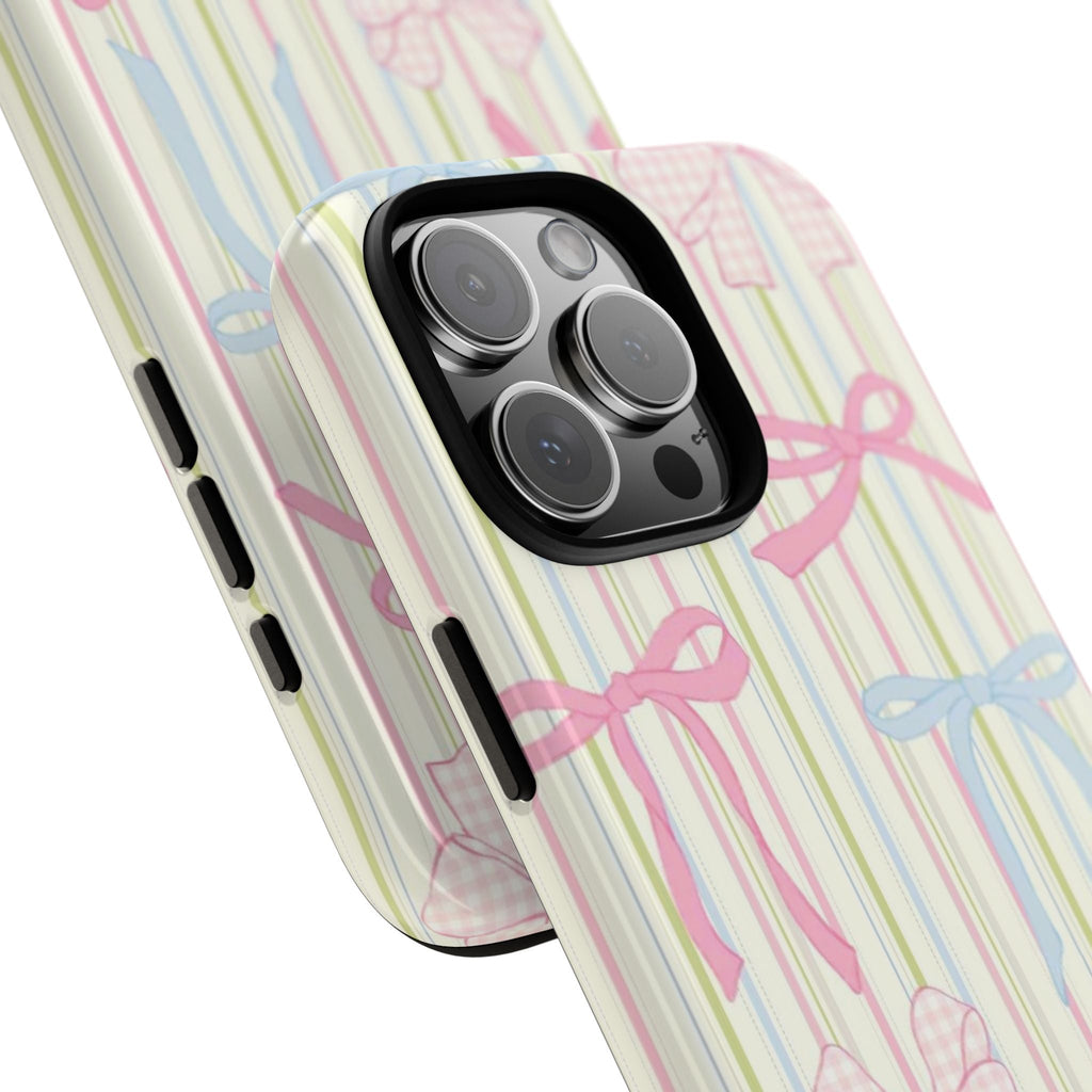 Angle view: pastel striped phone case with ribbon bow print and camera lenses