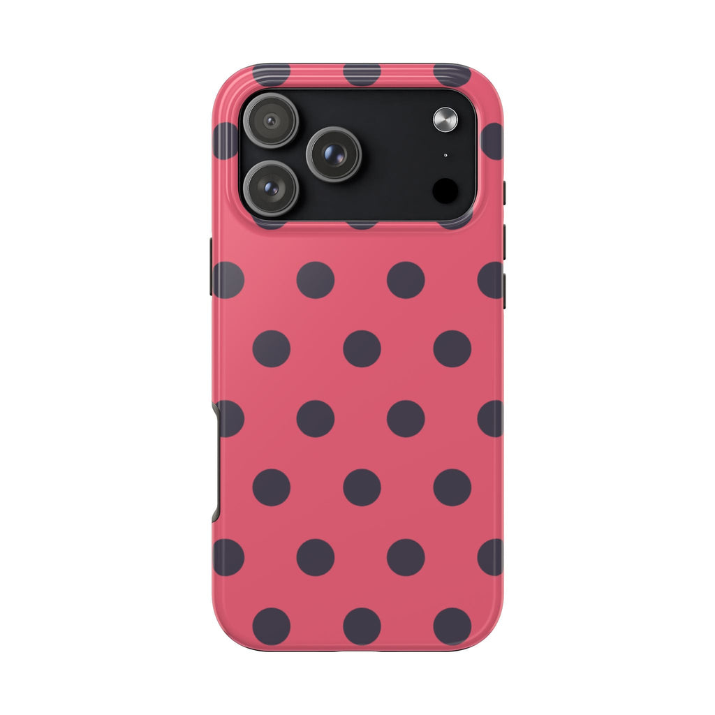 Coral pink phone case with dark polka dot pattern and raised camera protection
