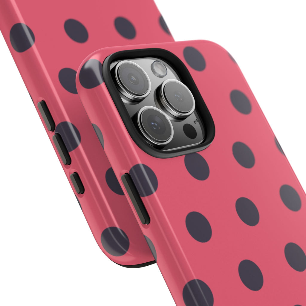 Coral pink polka dot phone case with raised camera lens cover and side buttons