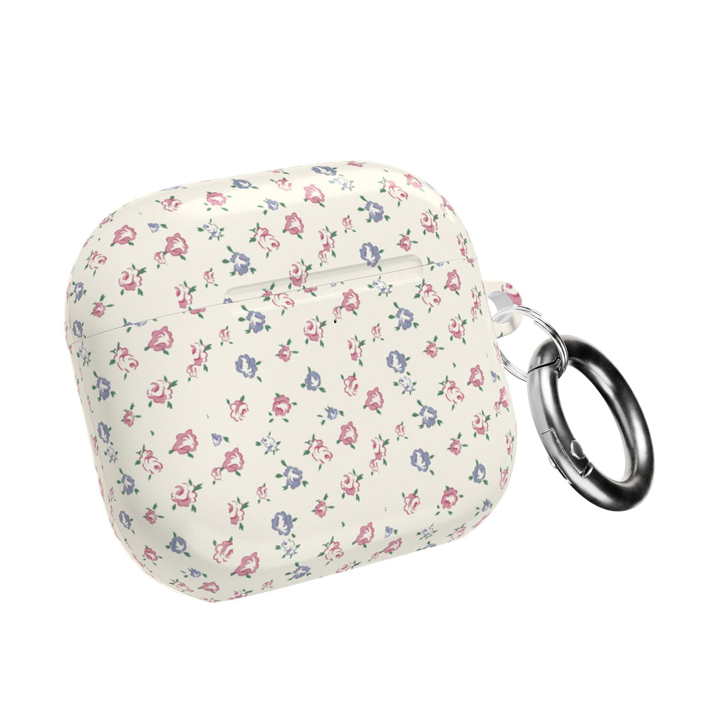 Floral AirPods case closed with metal key ring; cream with small pink and blue flowers