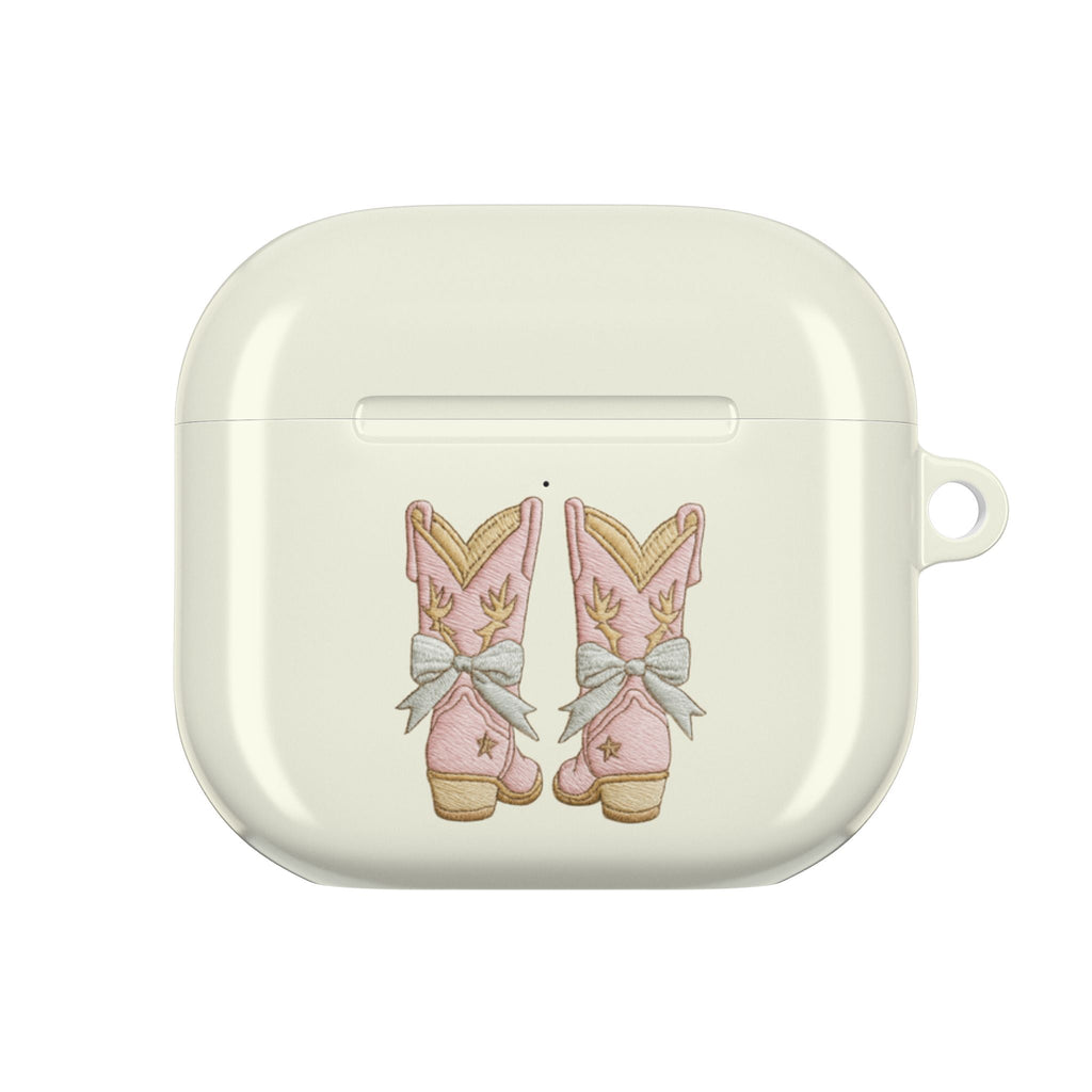 Light cream AirPod case front with cowboy boot bow illustration and side loop
