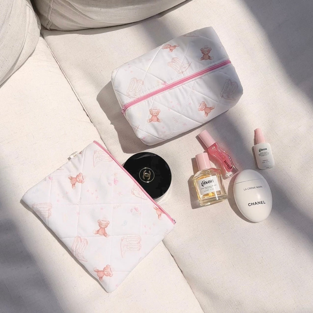 White quilted pouch set with pink zippers and teddy bear motifs