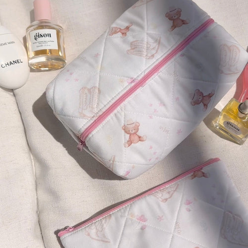 White quilted pouch with allover teddy bear pattern and bright pink zipper