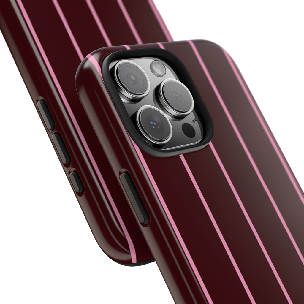 Burgundy phone case with vertical pink stripe pattern and raised camera cutout