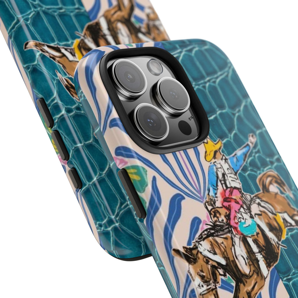 Side view of croc-style phone case with cowboy rider artwork and blue floral swirl detail