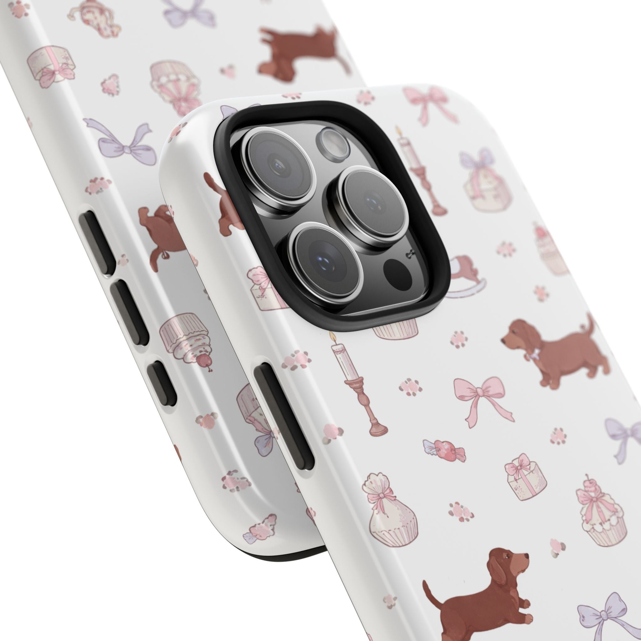 Angled view of white dachshund and pink bow phone case with raised camera lens cover