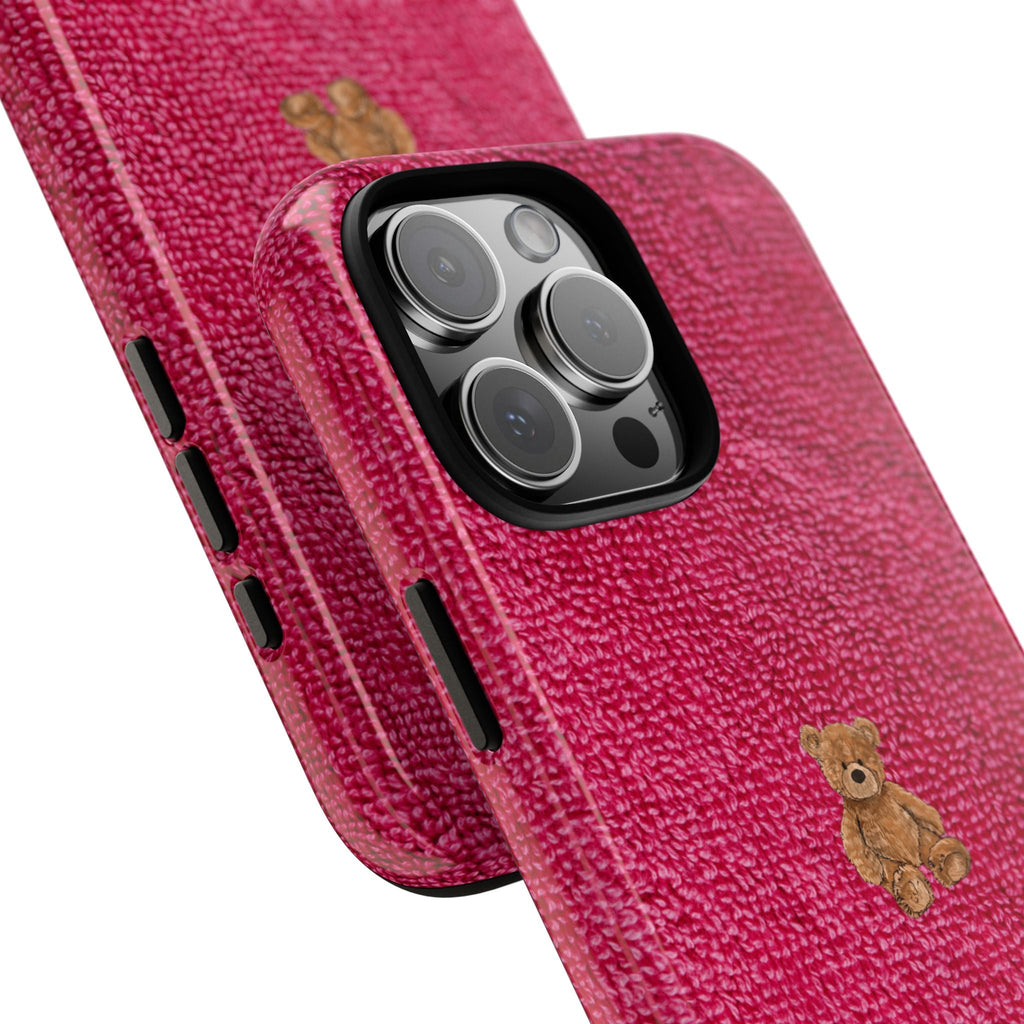 Dark pink textured phone case, teddy bear on back; camera cutout and side slots