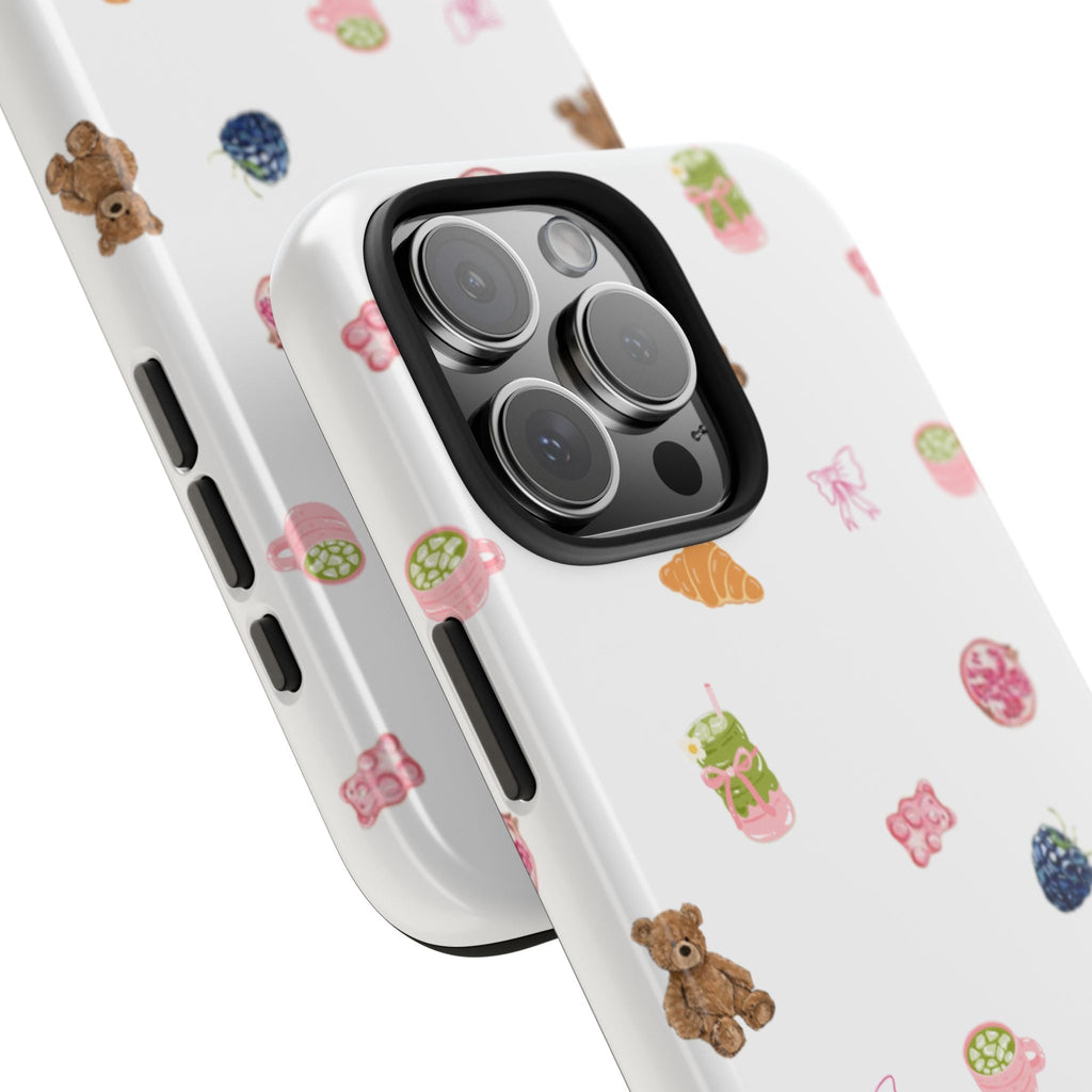 Close-up of white phone case with breakfast icons and triple-lens camera cutout