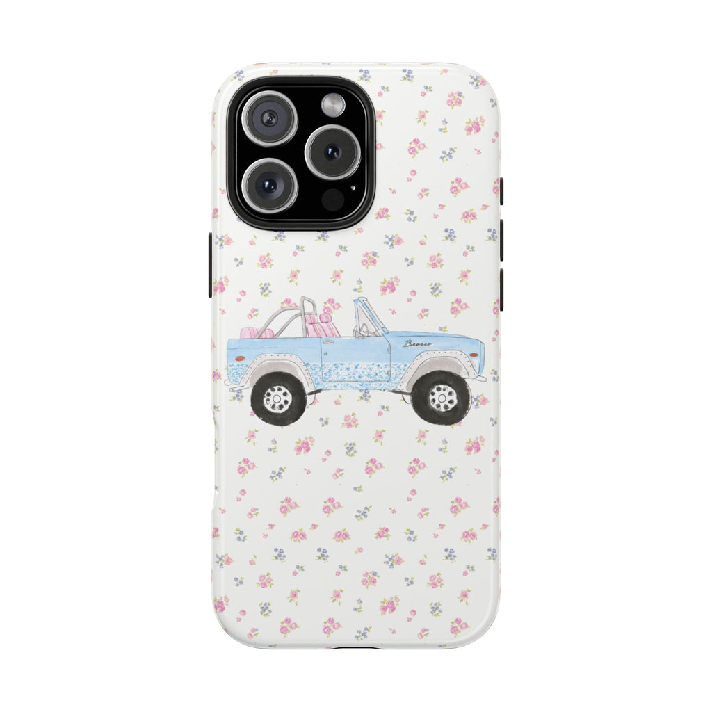 Vintage bronco phone case with ditsy floral pattern, blue truck on white background