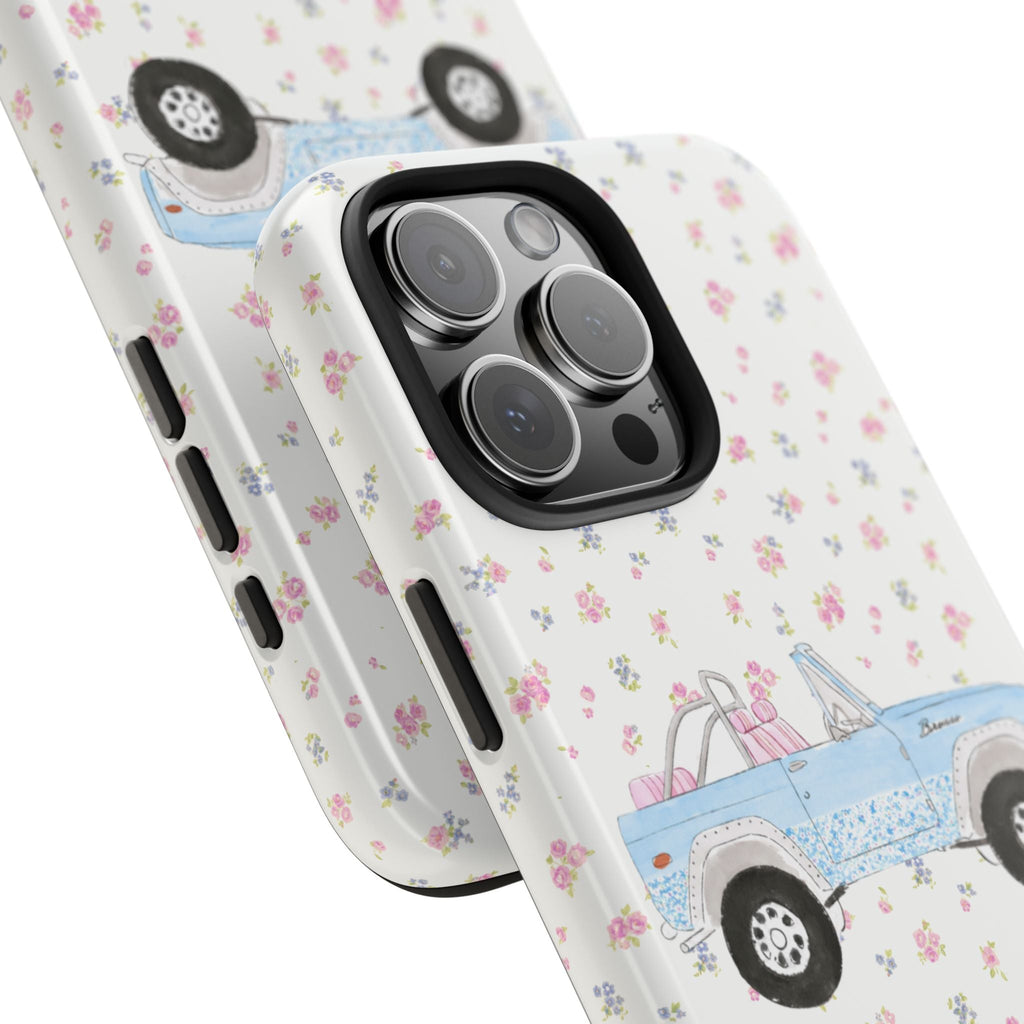 Angled view of phone case: blue vintage bronco and ditsy floral pattern over white