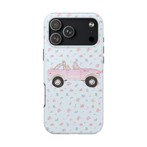 Light blue ditsy floral phone case with pink Bronco truck; back camera lens cutouts