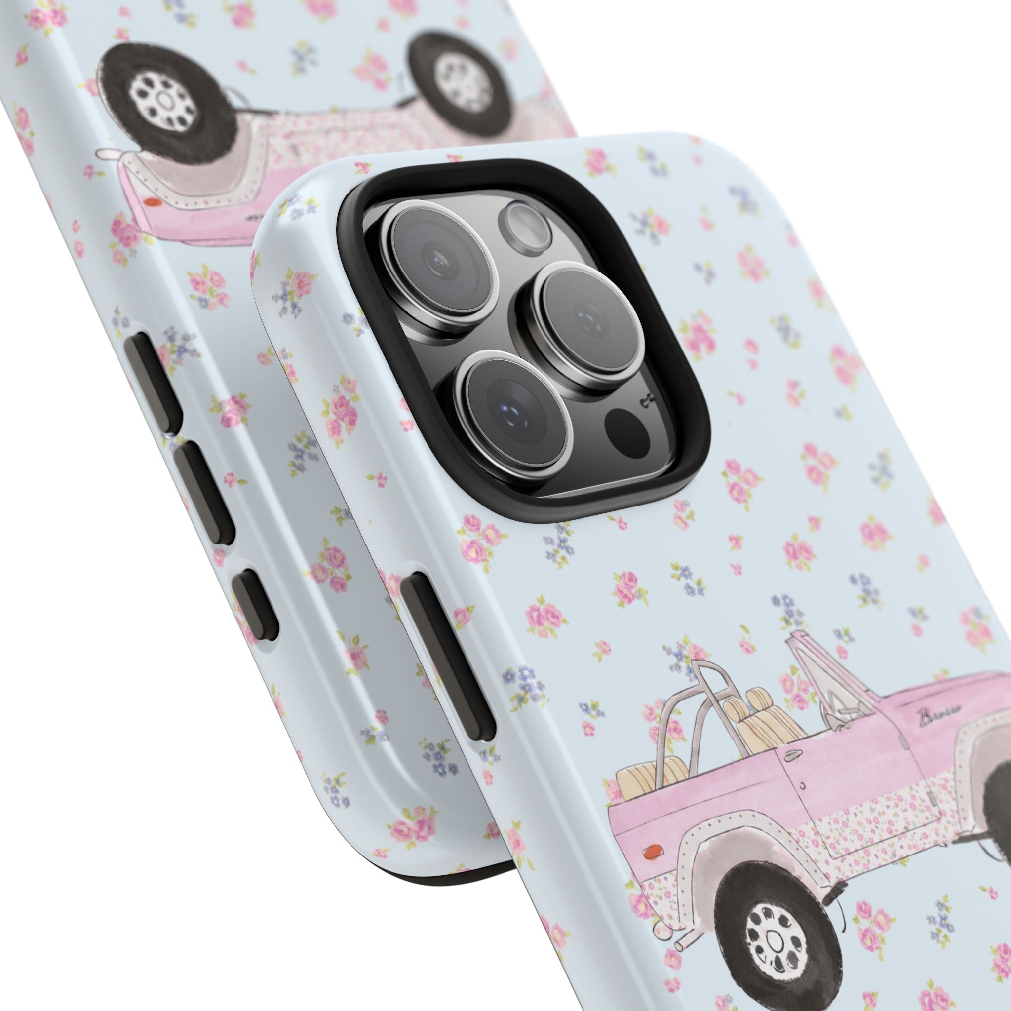 Angled light blue ditsy floral phone case with pink Bronco truck; side buttons shown