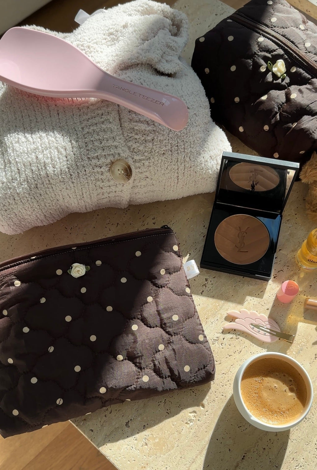 Fluffy light pouch and dark polka-dot zip pouch, both with light dots