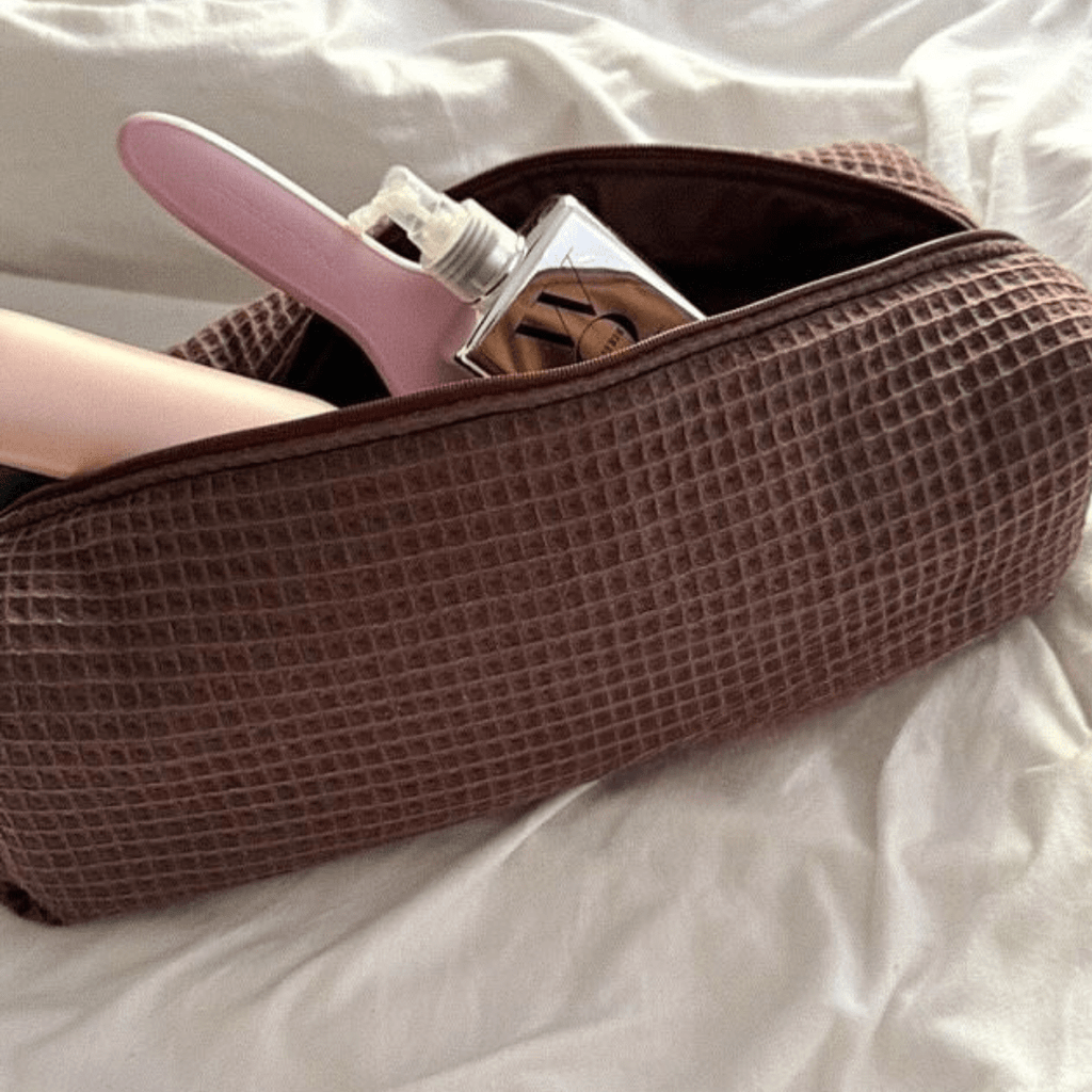 Espresso brown waffle knit long pouch with zipper, opened to dark interior