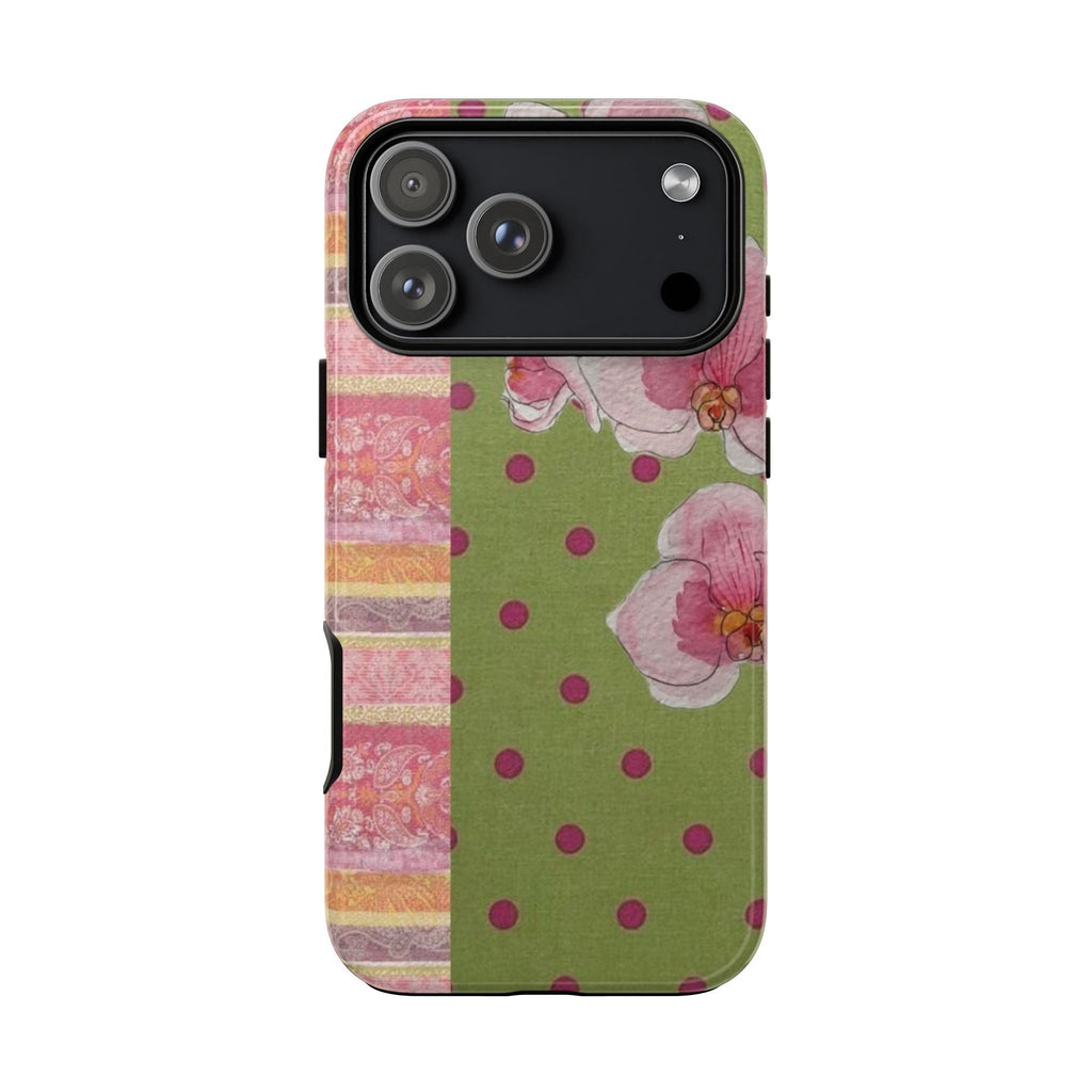 Floral patchwork phone case with pink blooms and purple polka dots on green