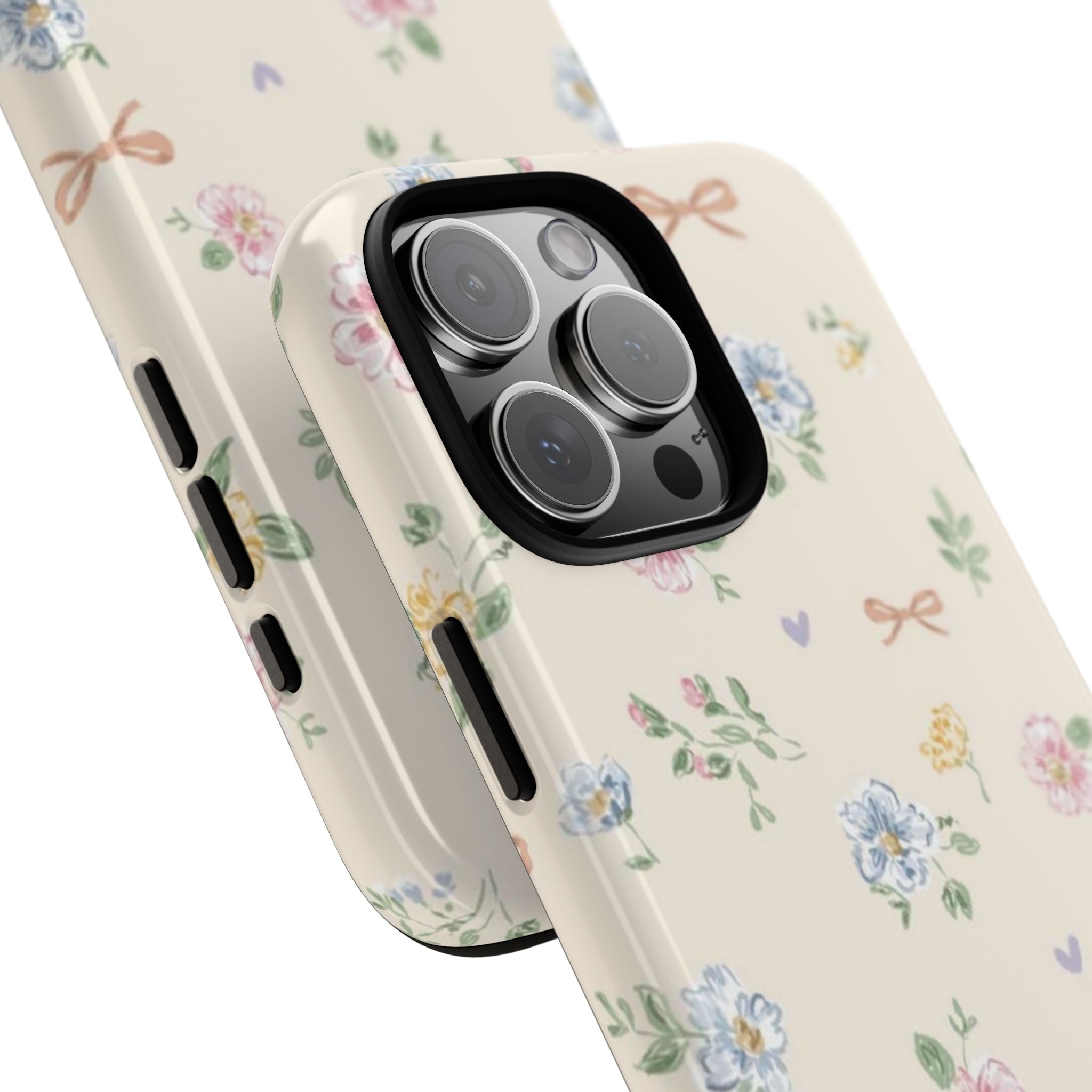 Cream floral phone case with bow-and-flower pattern over triple camera area