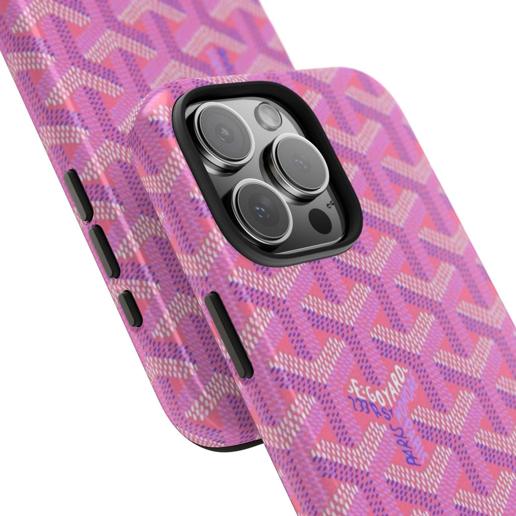 Fuchsia pink Goyard-style phone case angled view with raised camera lip and side buttons