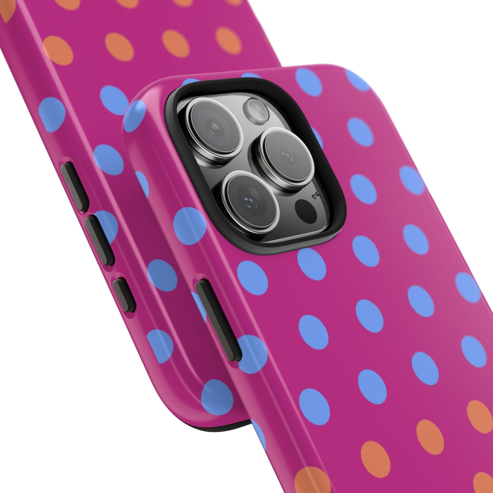 Pink polka-dot phone case close-up showing camera lenses, flash, and side buttons
