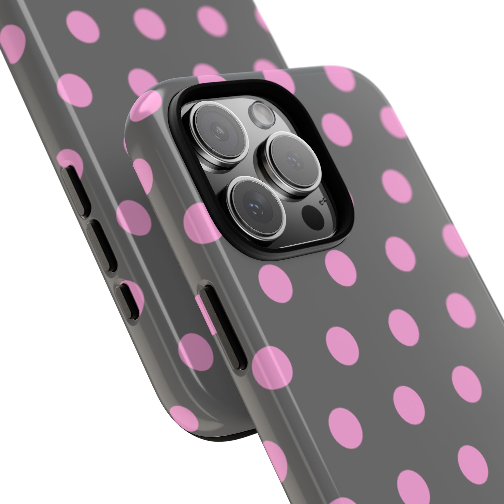 Angled view of gray phone case with pink polka dots and raised camera lens cover