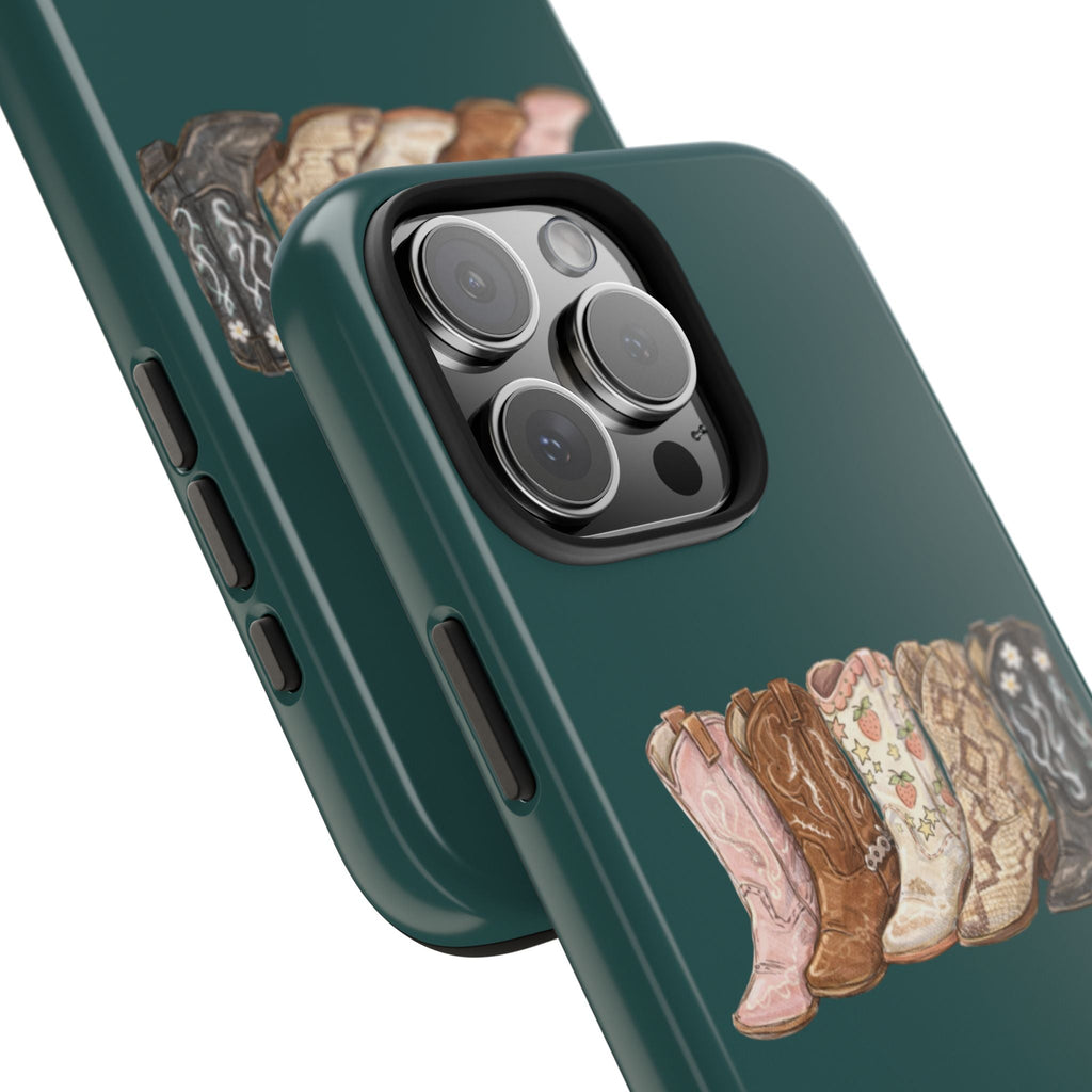 Dark green cowgirl boots phone case, close-up view near camera lenses