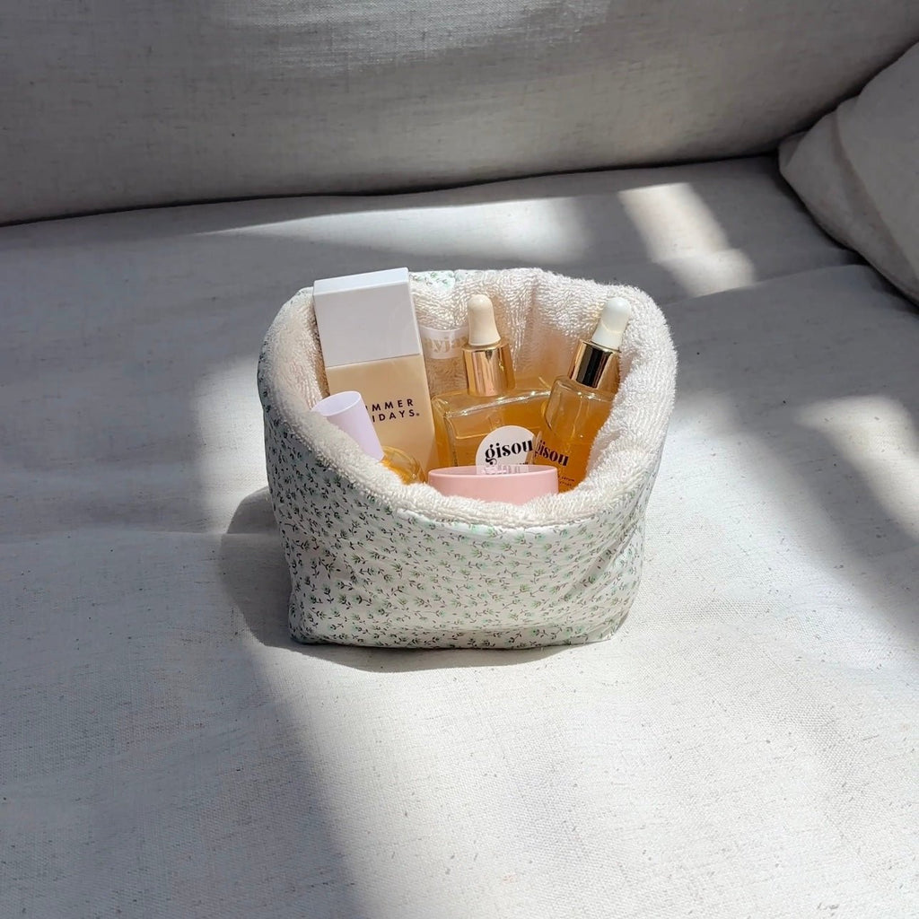 Green ditsy floral fabric organizer, round bin with open top and plush lining