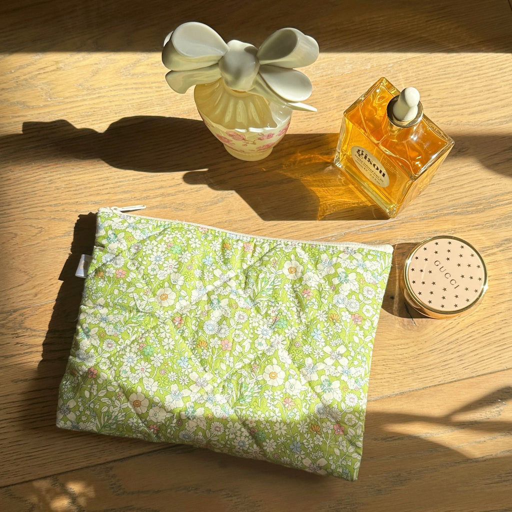 Green floral cosmetic bag with zipper, flat rectangular pouch