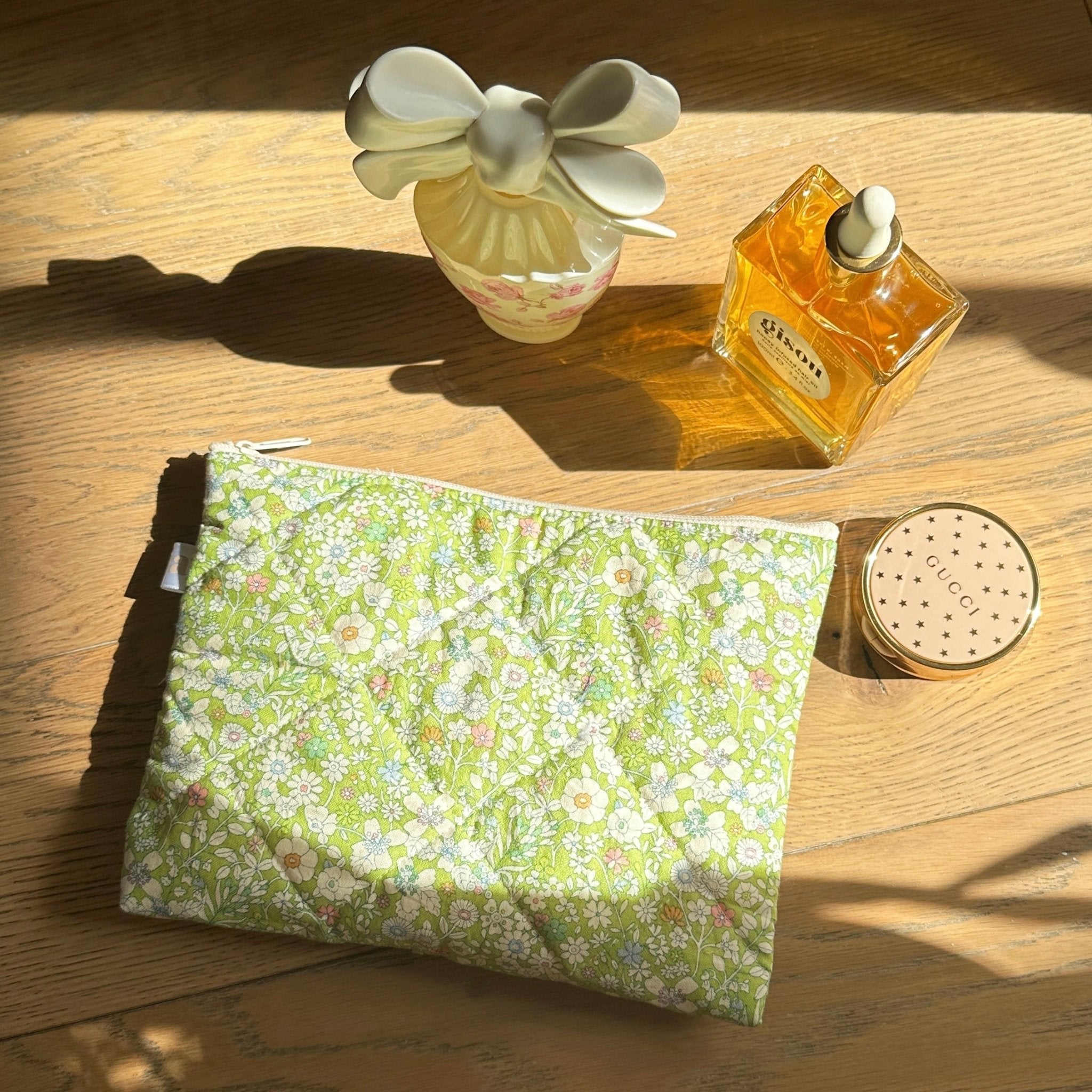 Green floral cosmetic bag with zipper, flat rectangular pouch