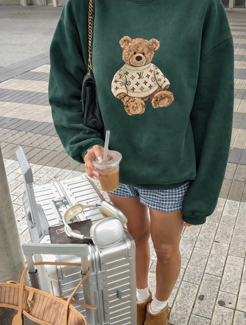 Dark green crewneck sweatshirt with teddy bear graphic on front, long sleeves