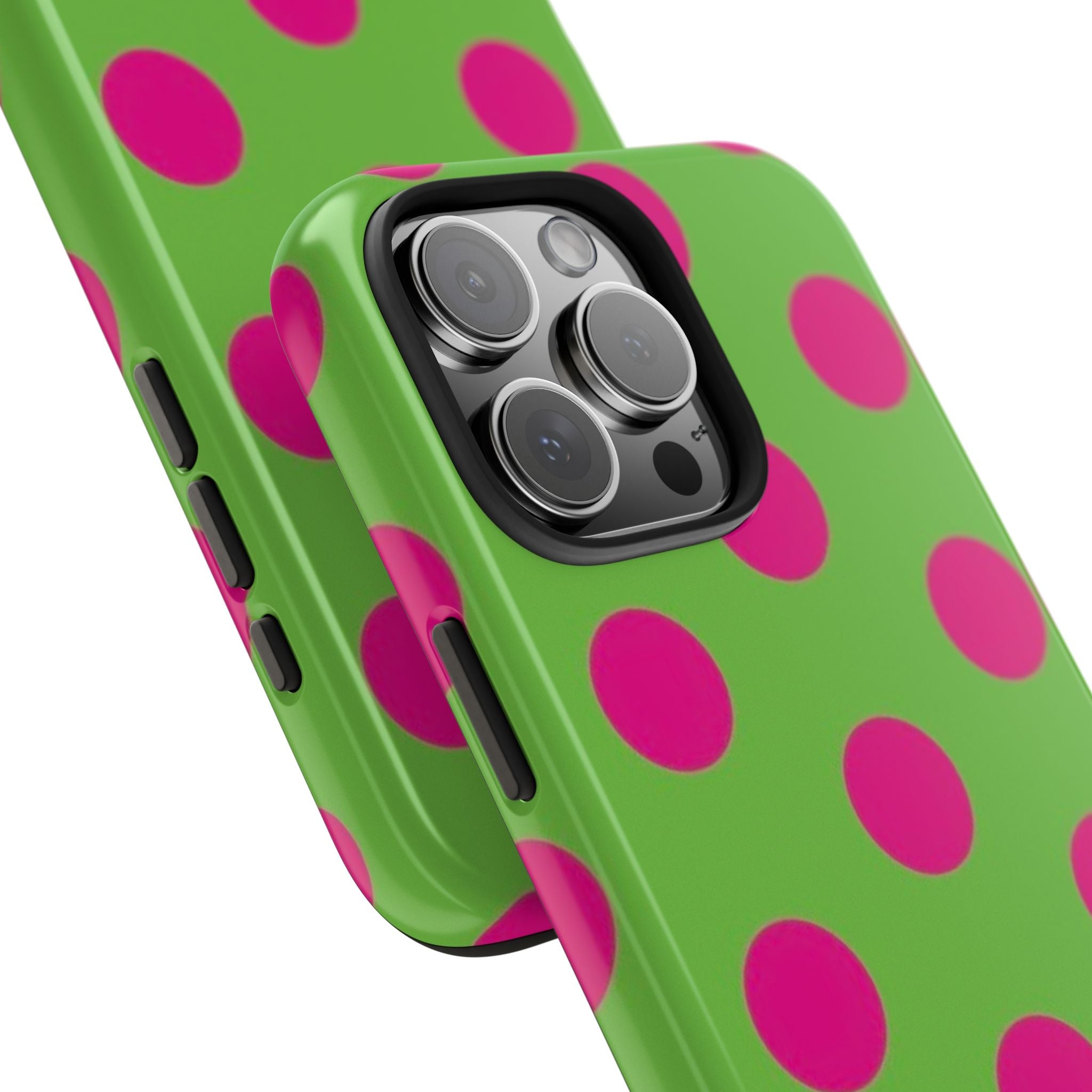 Green polka dot phone case close-up with magenta dots and side button openings