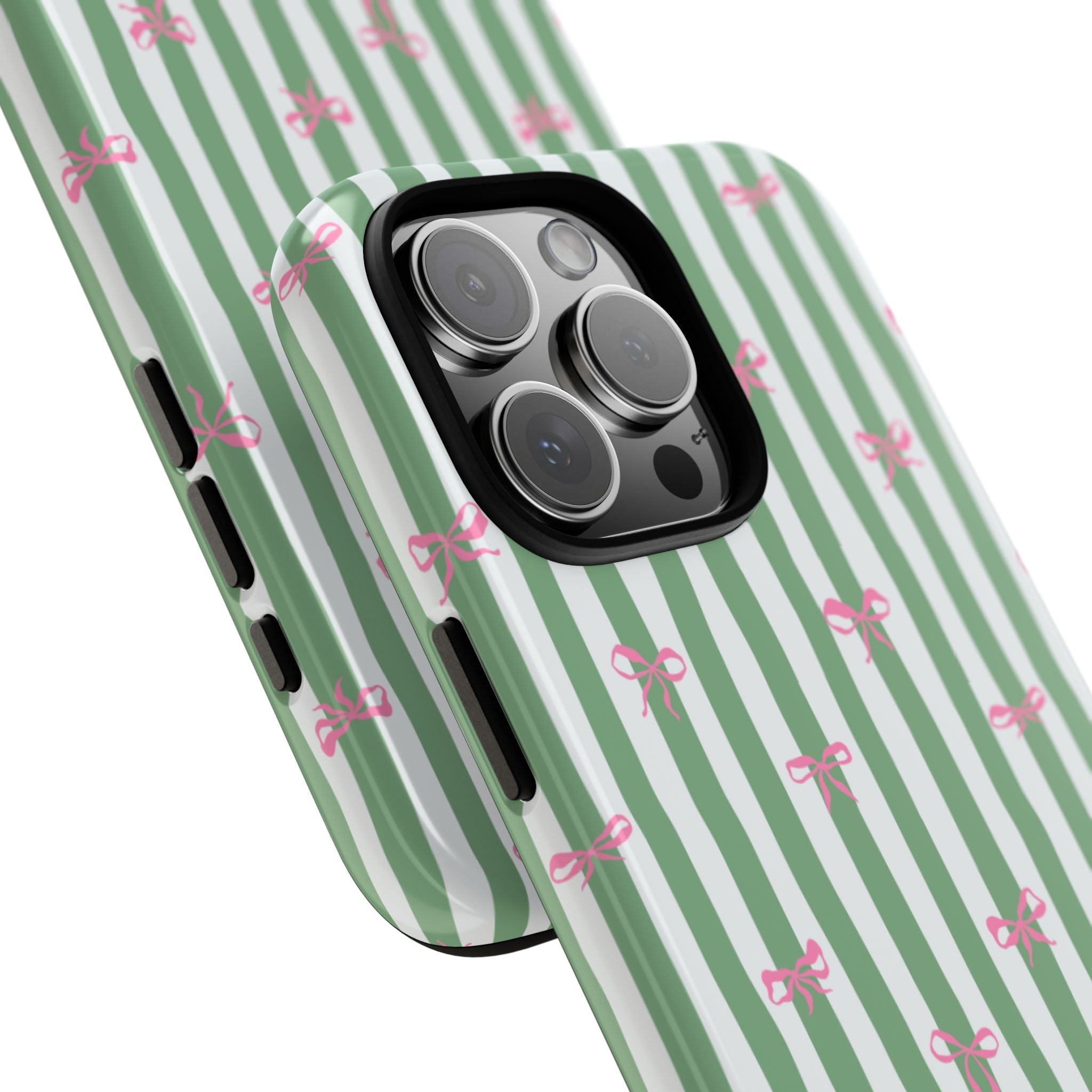 Side view of green striped phone case with pink bows; cutouts along the edges