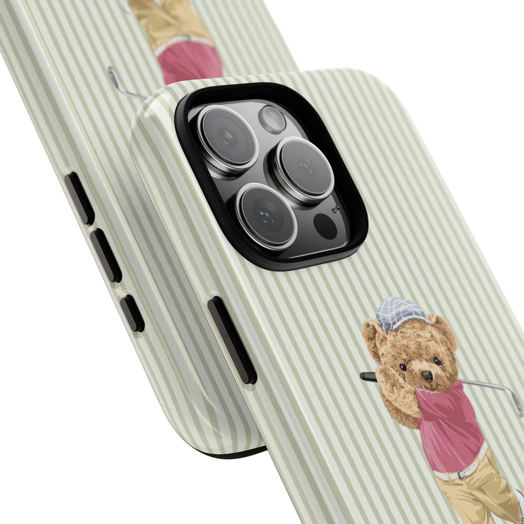 Close-up green striped case with teddy bear golfer and cutout around camera lenses