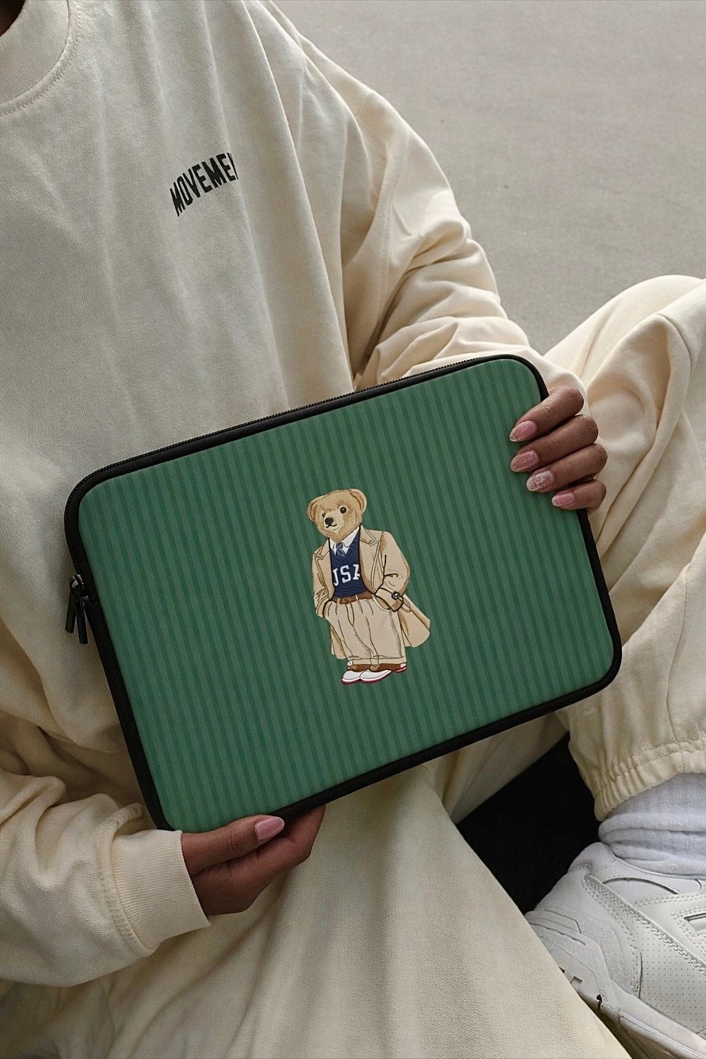 Green striped neoprene sleeve with teddy bear patch and zipper