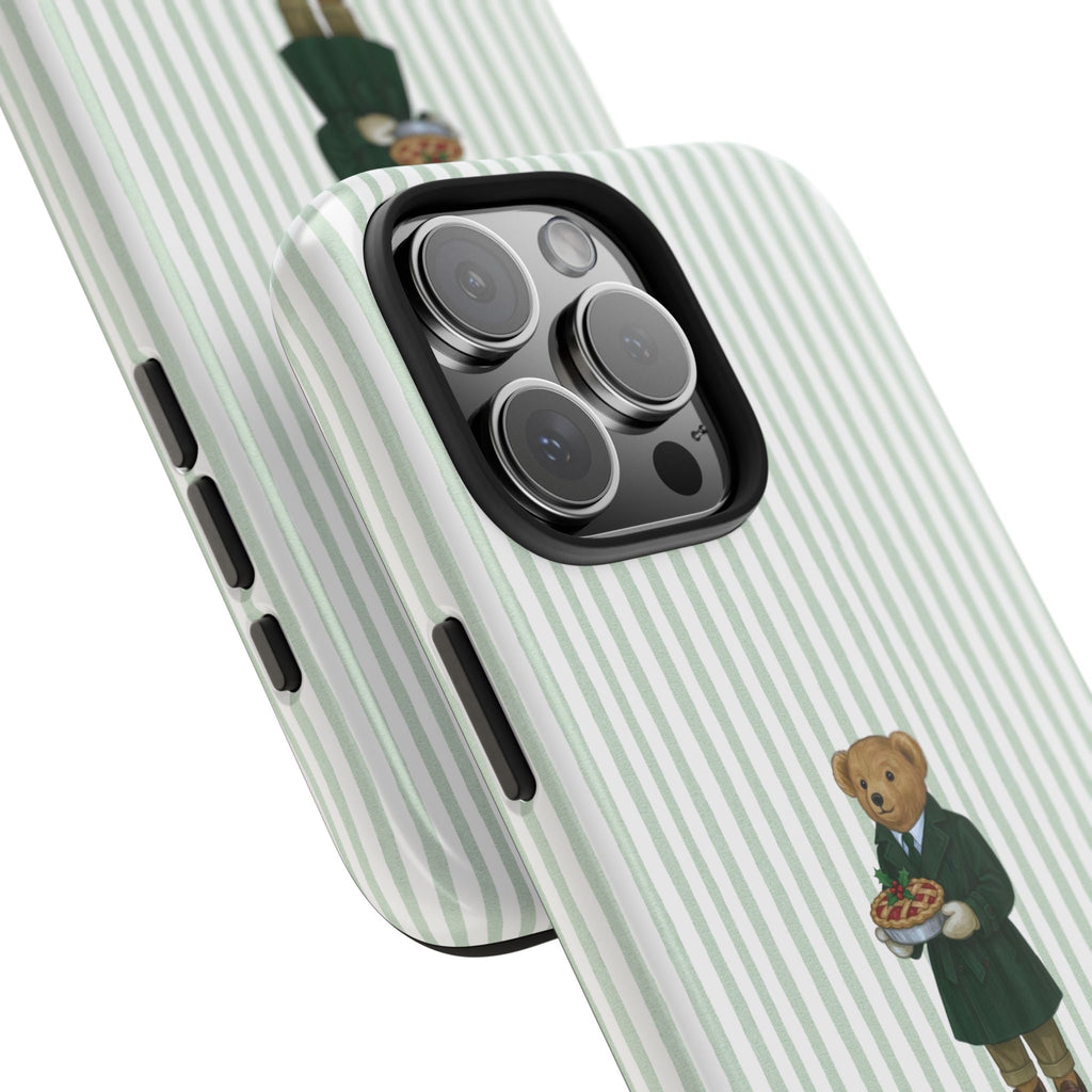 Green striped case with teddy bear in suit near camera cutout, side view