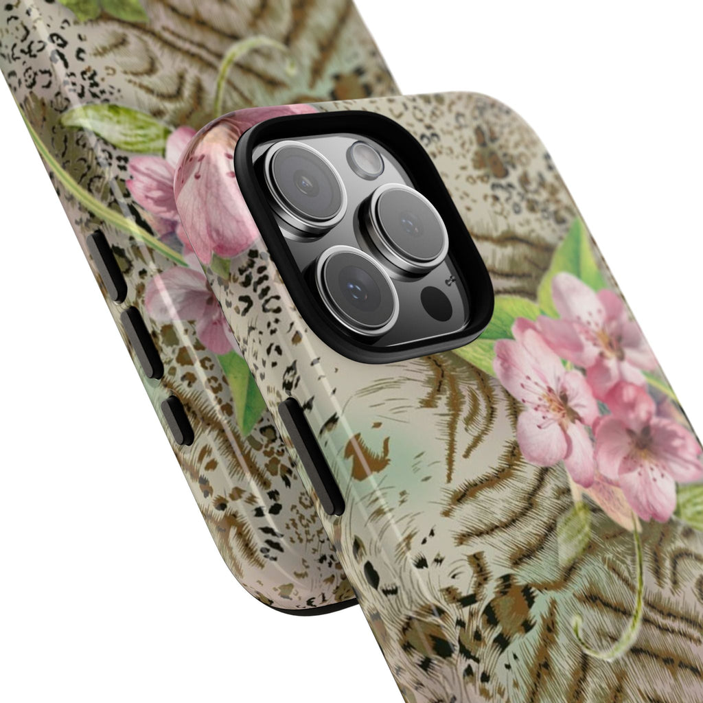 Phone case close-up, green tiger-stripe pattern with leopard dots and pink flowers, side button cutouts
