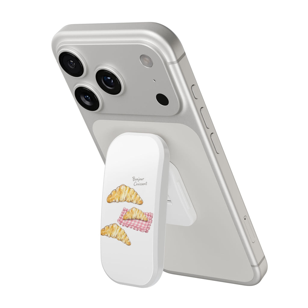 Light gray phone case with croissant stickers and built-in grip/kickstand