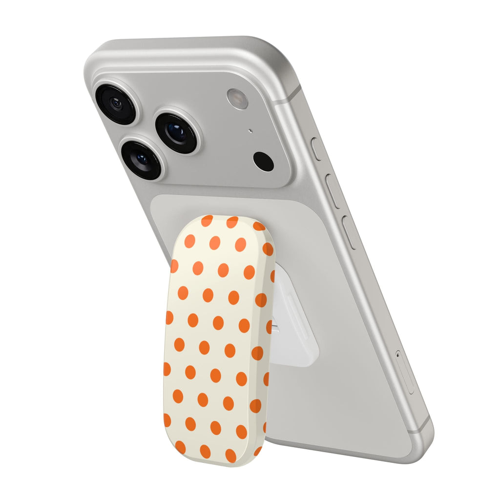 Cream phone case with orange polka-dot grip near camera cutouts, side buttons