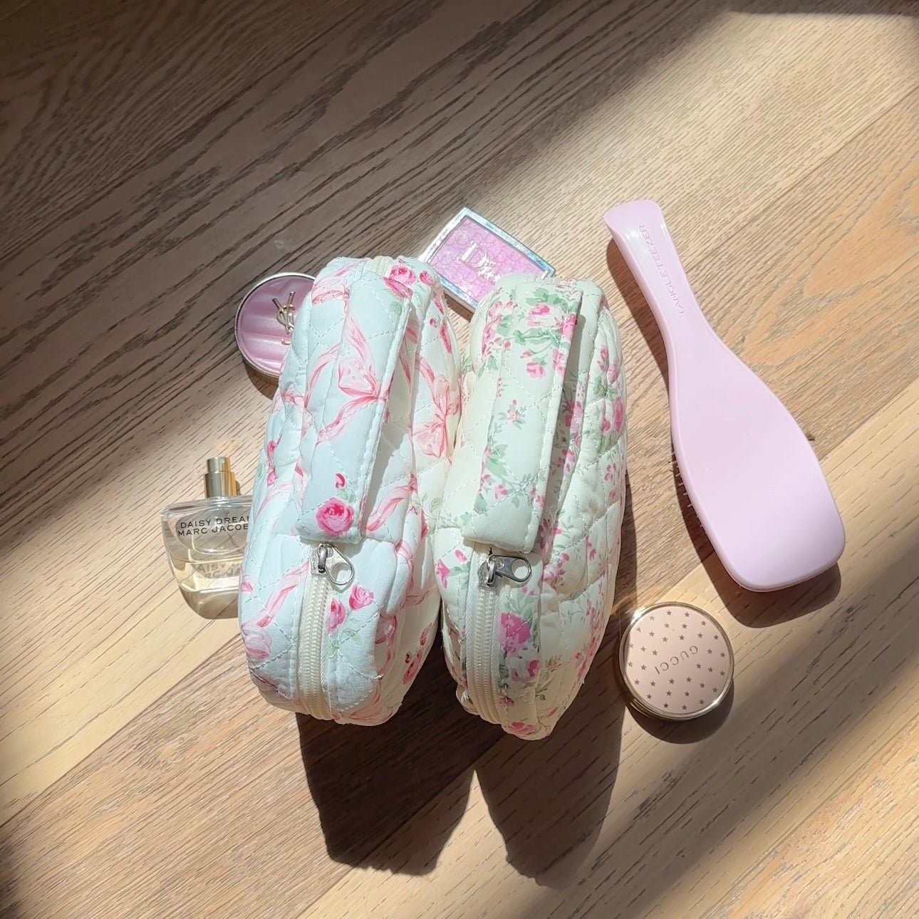 Quilted heart bag in light color with pink floral print and bow detail