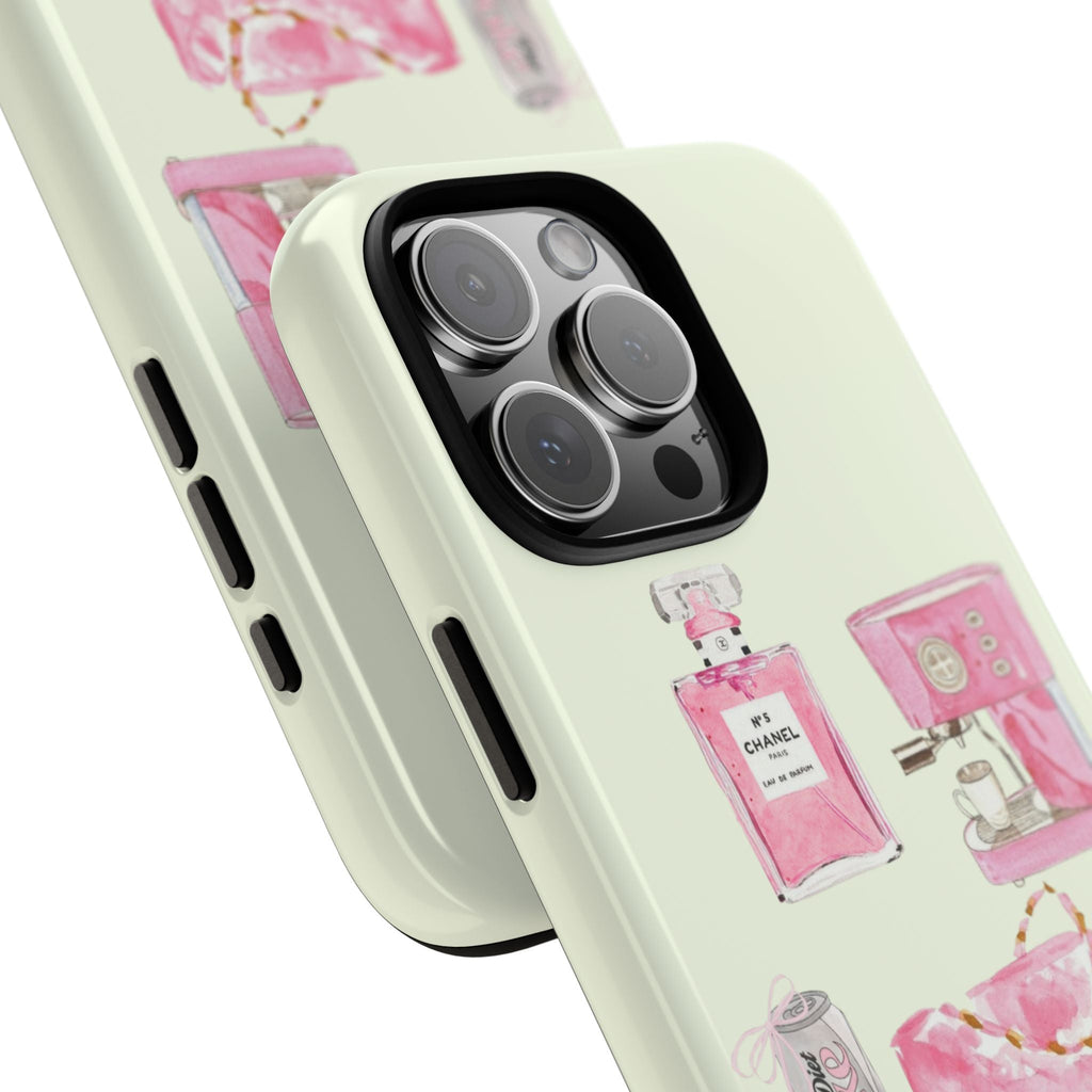 Cream phone case angled view: pink perfume print, raised camera ring and side cutouts