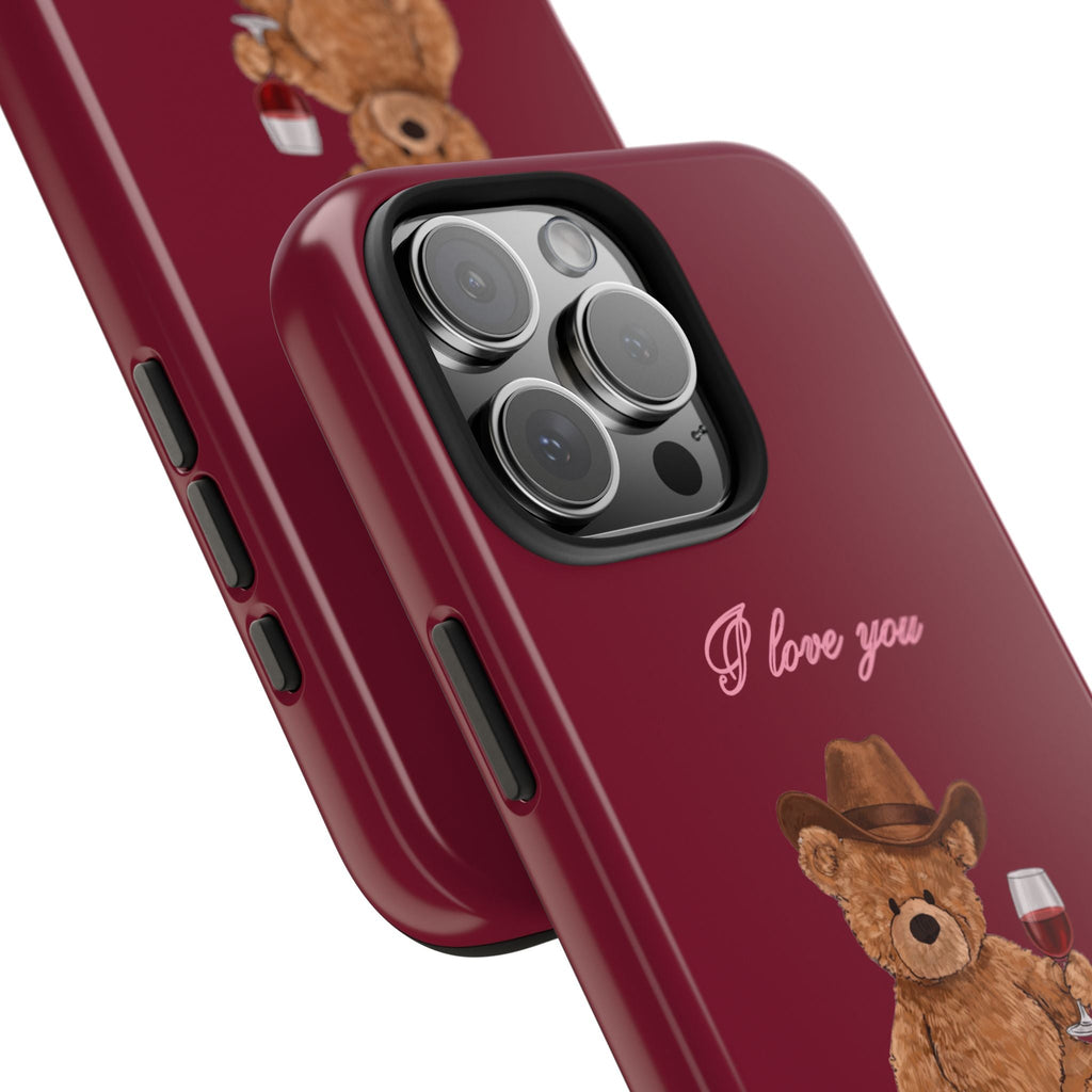 Burgundy phone case corner with camera cutout, 'I love you' script, teddy bear