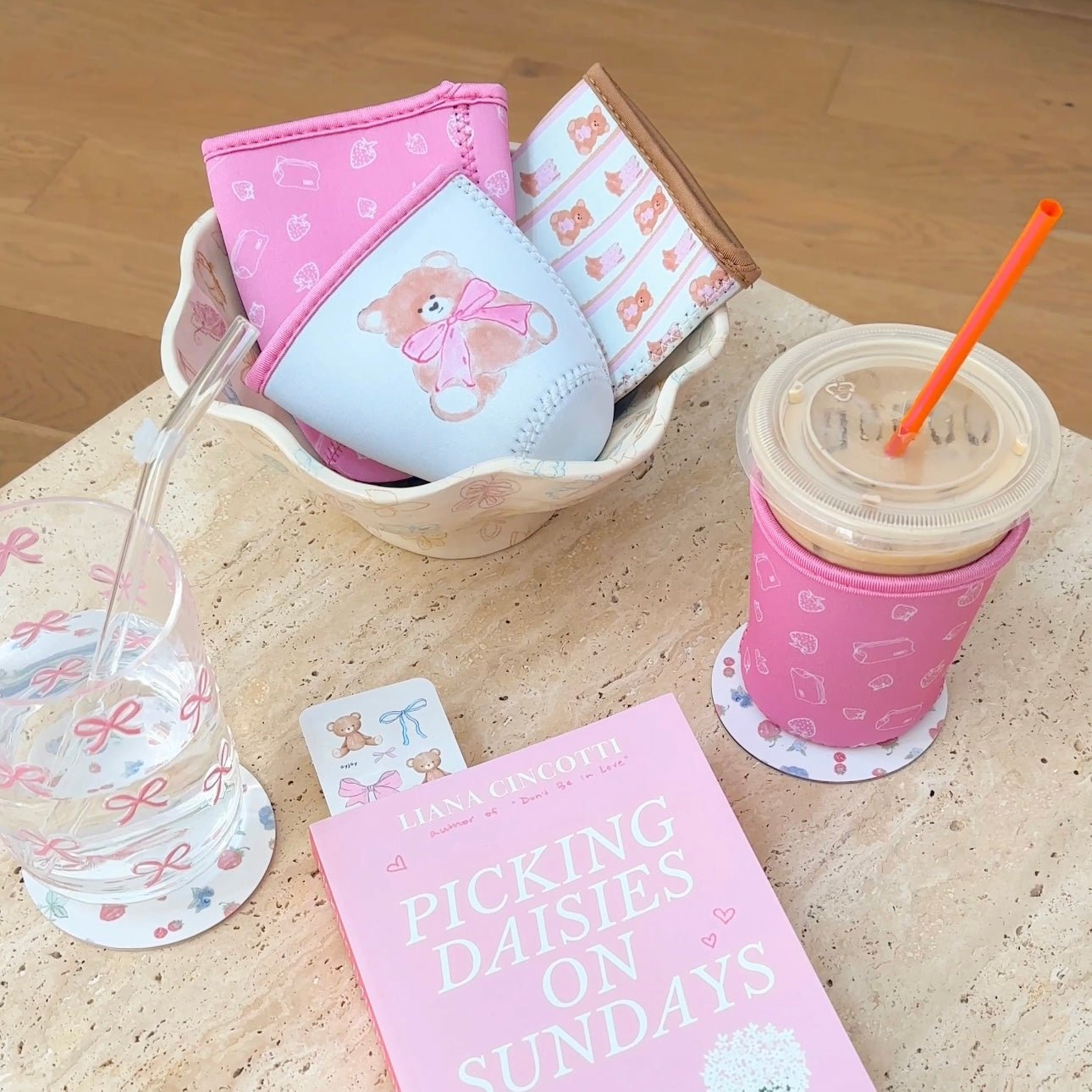 Iced coffee coozie, size M, blue-and-pink with oversized teddy bear graphic