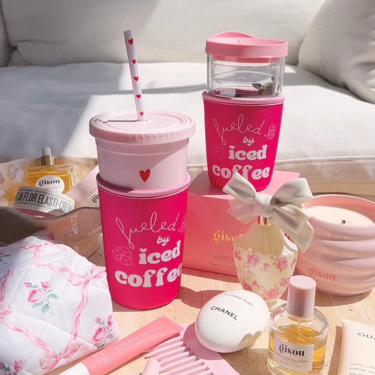 Pink iced coffee coozie with “iced coffee” text and heart, clear lid shown