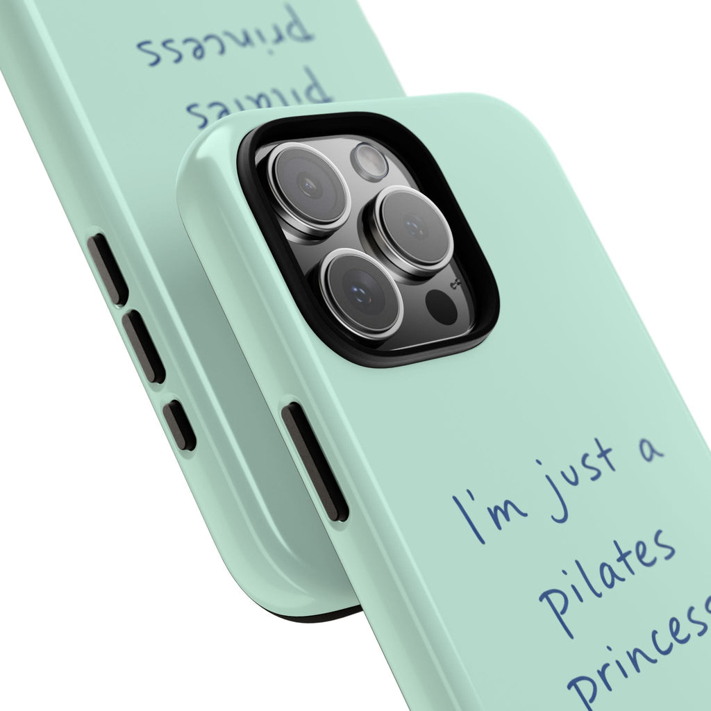Mint phone case angled view with blue “I’m just a pilates princess” text and camera lenses