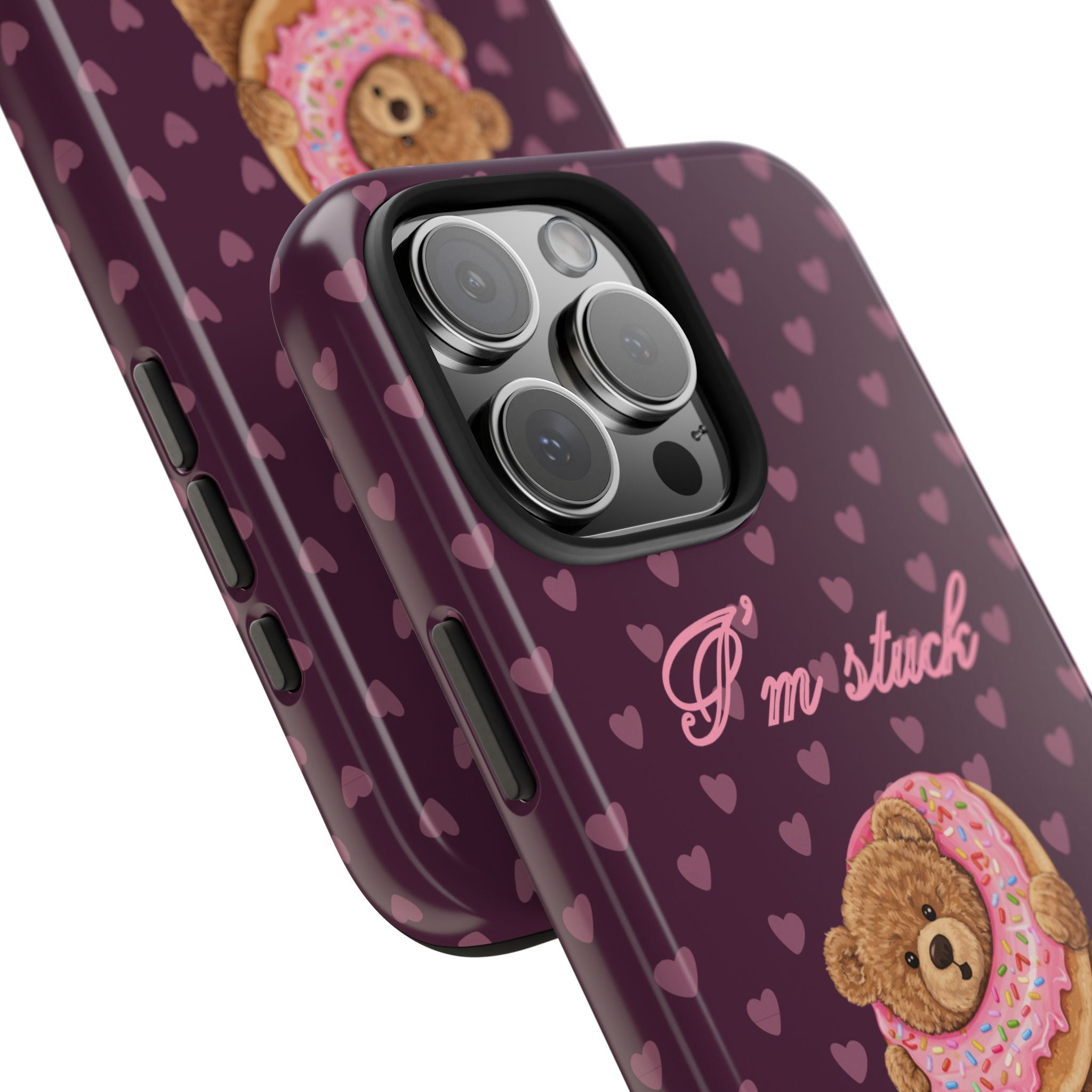 Angled purple teddy bear phone case: hearts pattern, donut graphic, “I’m stuck” text