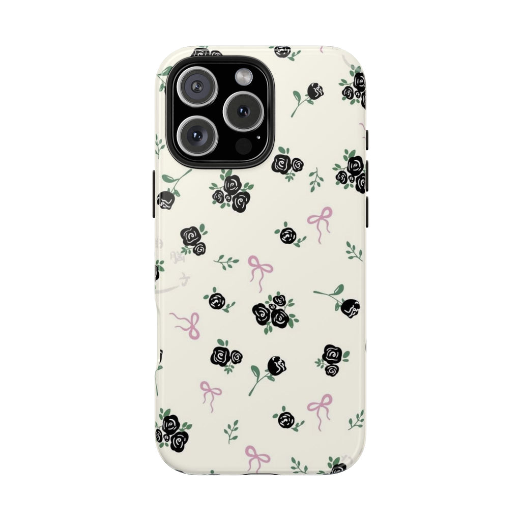 Ivory phone case with rose floral print, green leaves, and pink bows; camera cutout